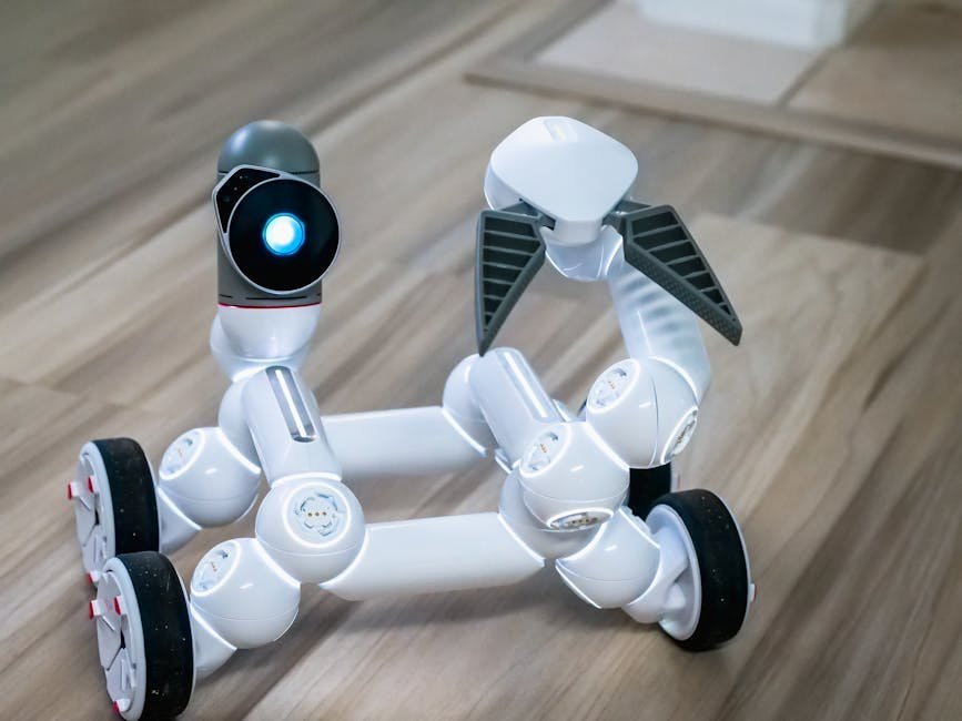 Close-up of a modern wheeled robot with a blurred background, indoors.