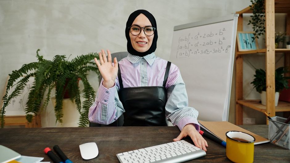 A mathematician reviews a computer screen showing AI-generated theorems and proofs replacing traditional manual writing