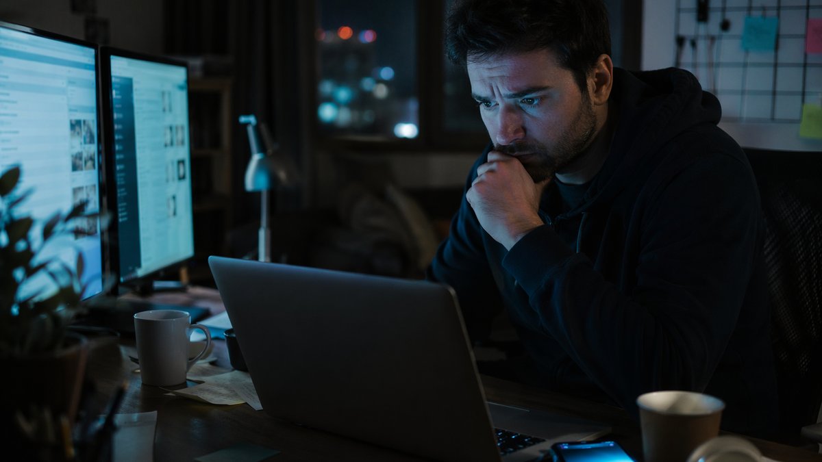 Community manager reviewing AI image censorship in South Korea policy updates on a laptop