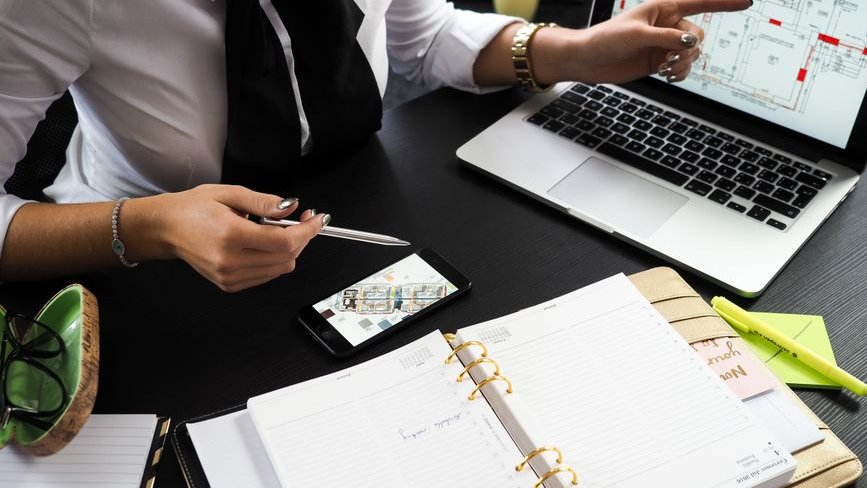 Real estate professionals review AI-generated listings to understand how automation impacts their business operations and client interactions