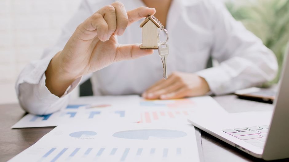 Real estate professionals using AI tools to update listings with clear disclosures and accurate property details