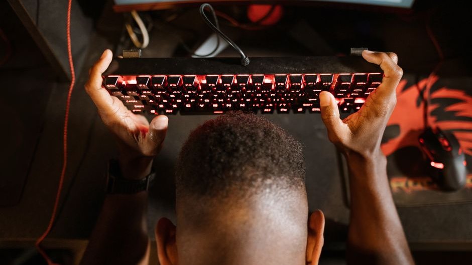 A split-screen image shows a developer smiling at an AI tool on the left and looking stressed at a cluttered workspace on the right highlighting the AI developer productivity gap