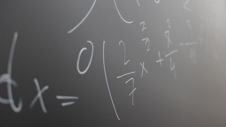 Glowing mathematical equations illuminate high performance server racks during an AI math breakthrough