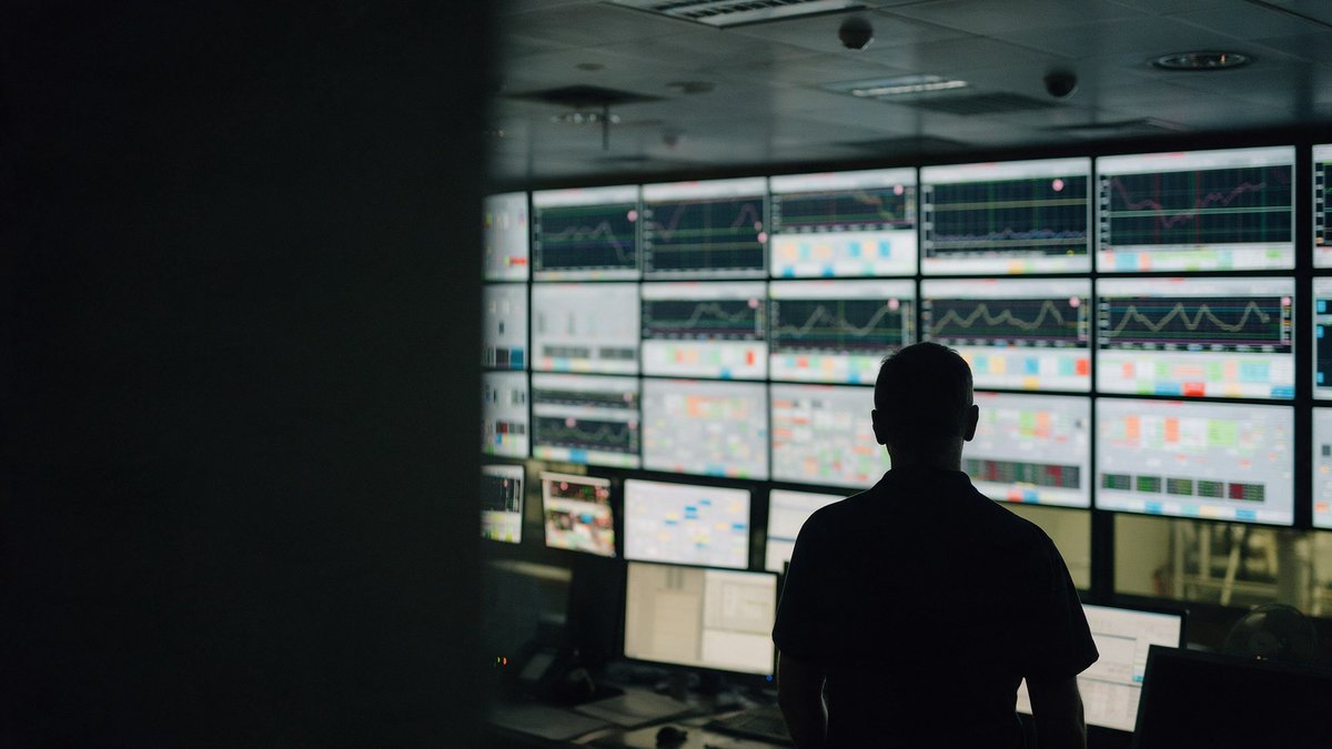 Analysts at NSA workstations run AI model testing on vendor software in a secure operations center